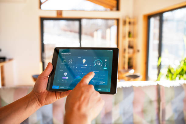 man using tablet with smart home automations control functions at home.